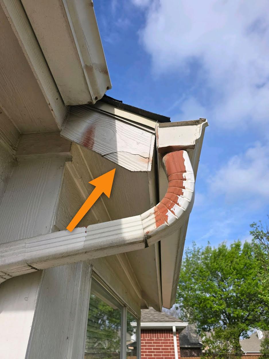 Cracked wood fascia board at the eave documented on an inspection in Anna, TX